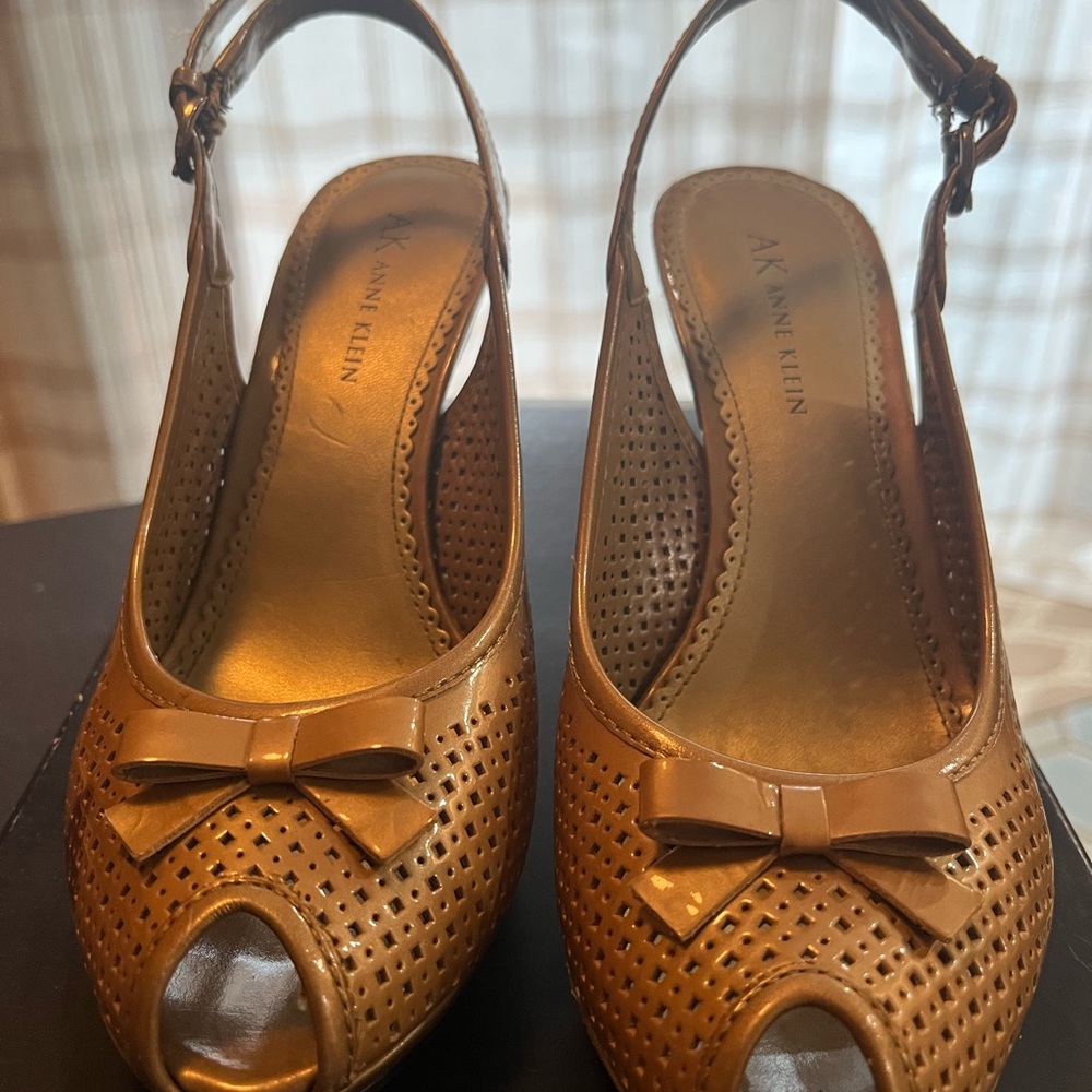 And Klein size 6, dark natural color, small blemish on one shoe
